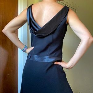 Draped back black dress with dropped waist